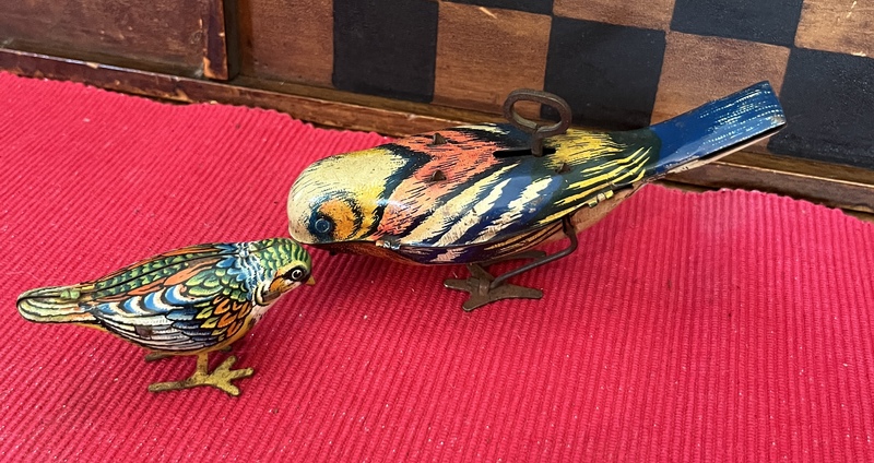Two Tin Bird Toys