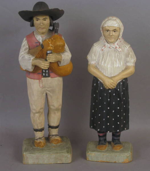 Two Carved Figures Dated 1934