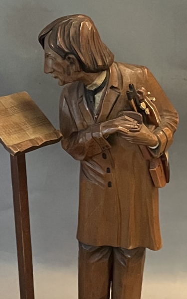 Carving of Violinist