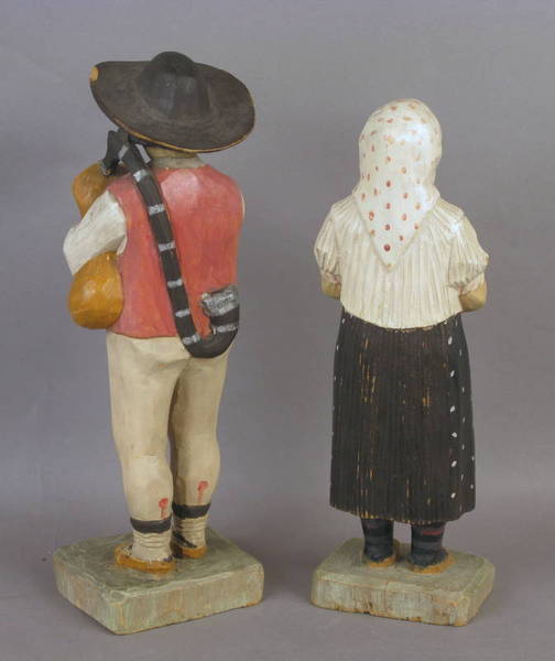 Two Carved Figures Dated 1934