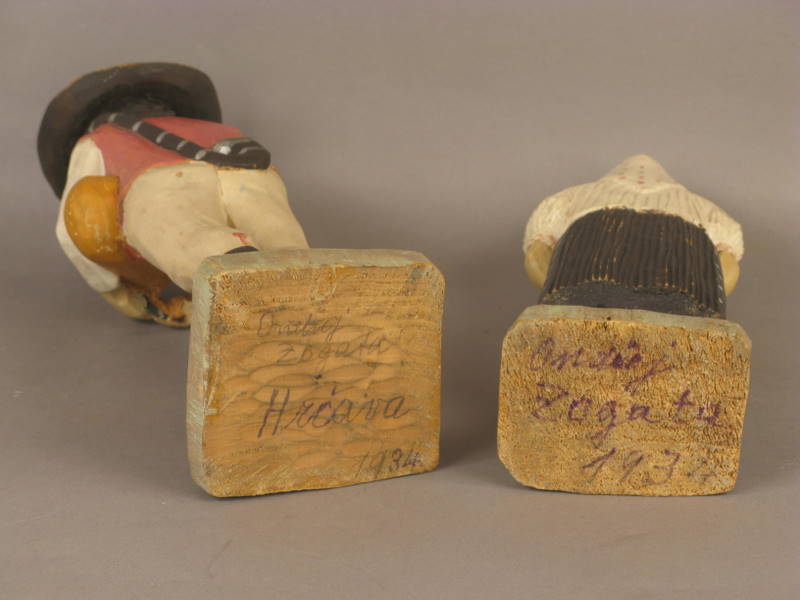 Two Carved Figures Dated 1934
