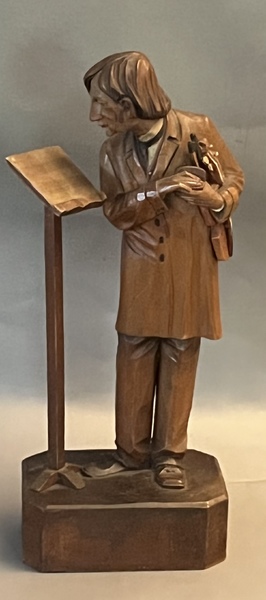 Carving of Violinist