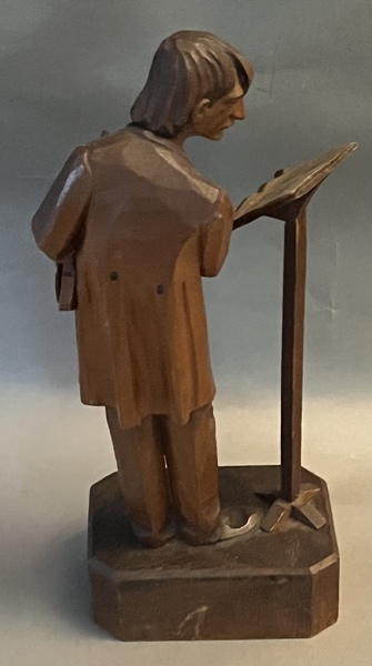 Carving of Violinist