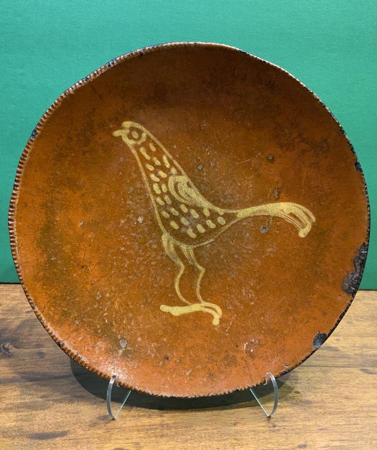 Redware Plate with a Yellow Slip Bird Decoration