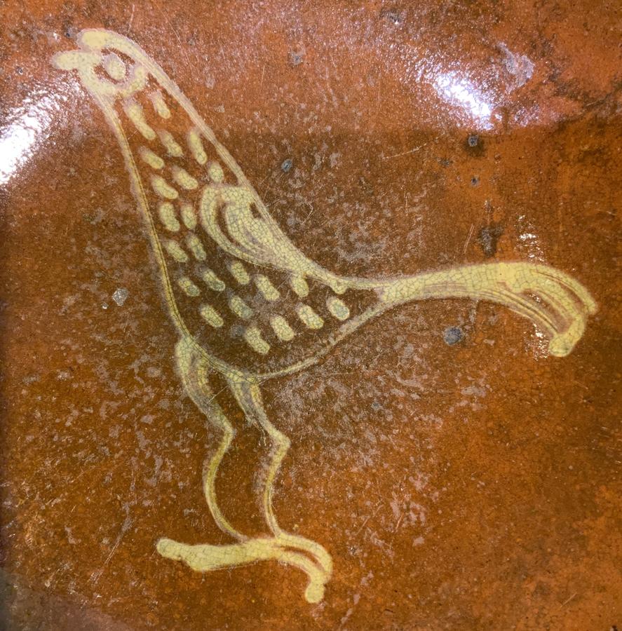 Redware Plate with a Yellow Slip Bird Decoration