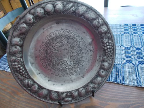 ODD METAL (PEWTER?) CHARGER