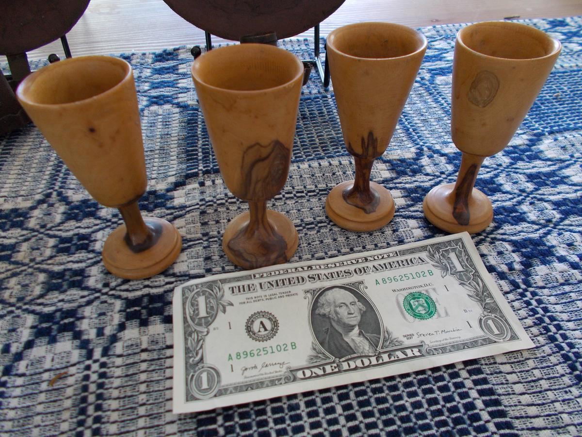 FOUR TREEN FOOTED DEMITASSE CUPS