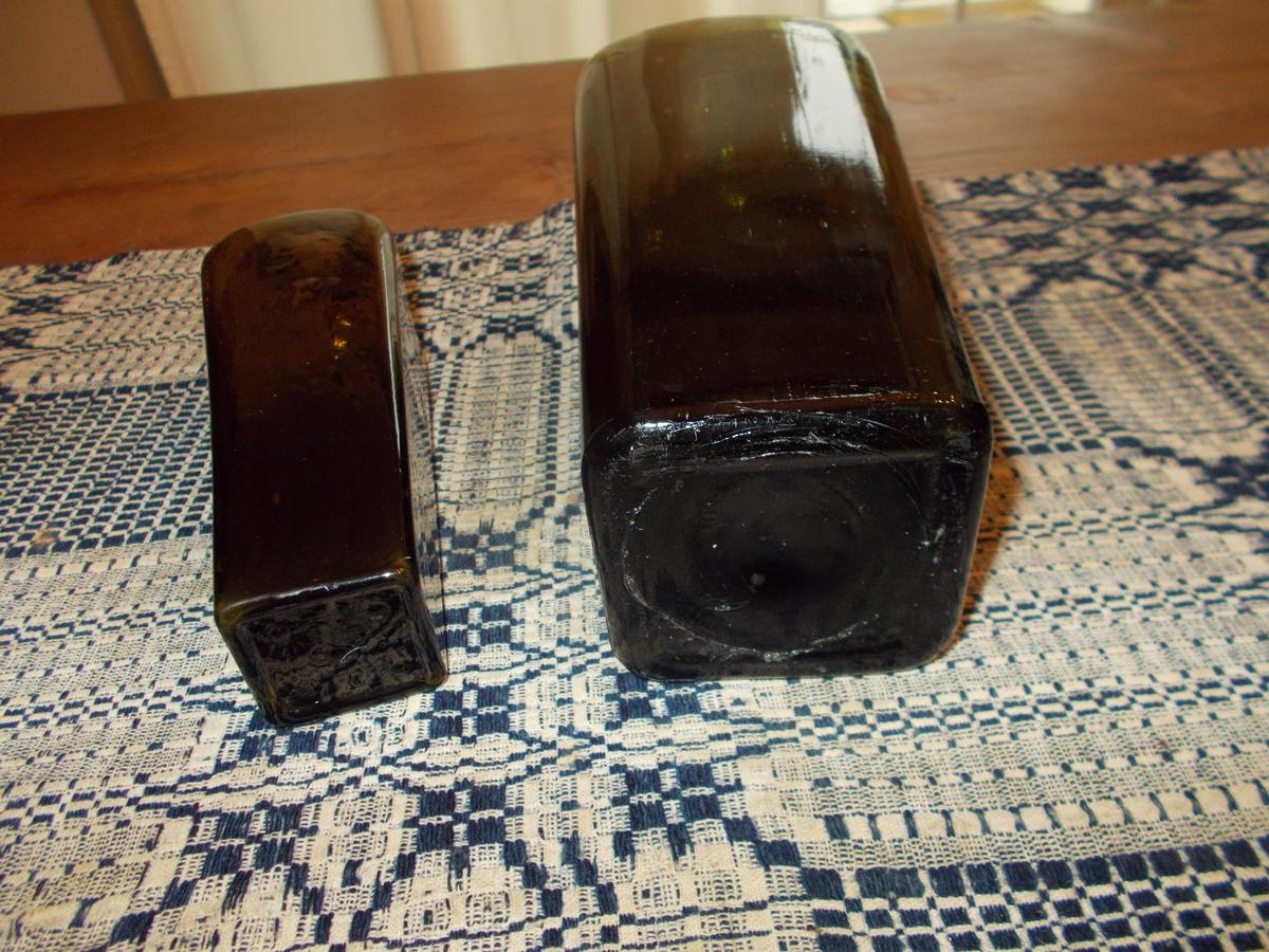 TWO GREEN GLASS GIN BOTTLES