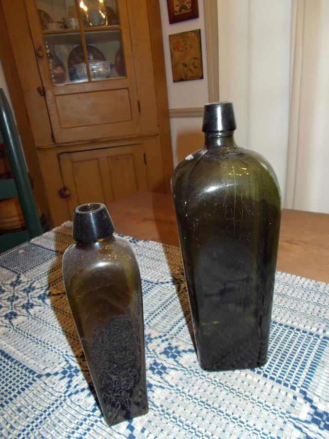 TWO GREEN GLASS GIN BOTTLES