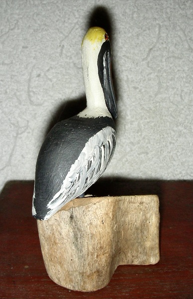 Small Carved Wooden Pelican on Stump