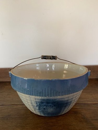 blue and white bail handled stoneware bowl