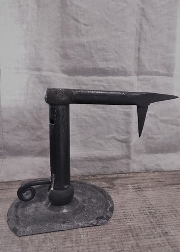 wrought candle holder for lighting ( in a mine?)