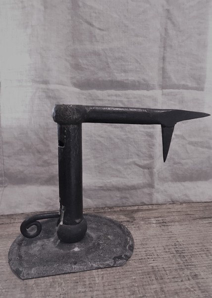 wrought candle holder for lighting ( in a mine?)