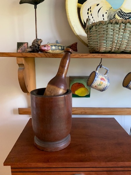 large wooden mortar and pestle
