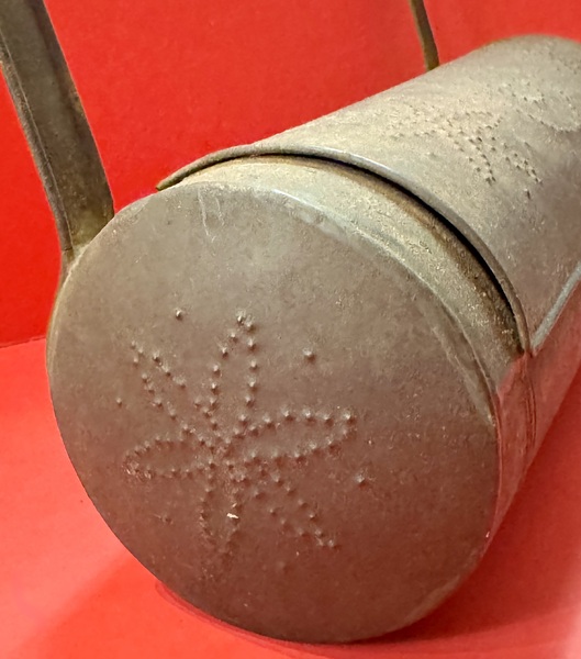25-076. Cylindrical, pierced tin candle box