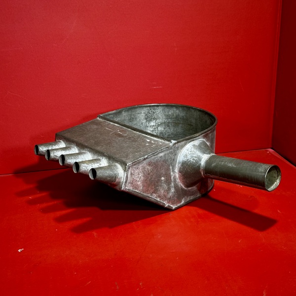 26-066. A Tin Candle Mold Wax-Filler