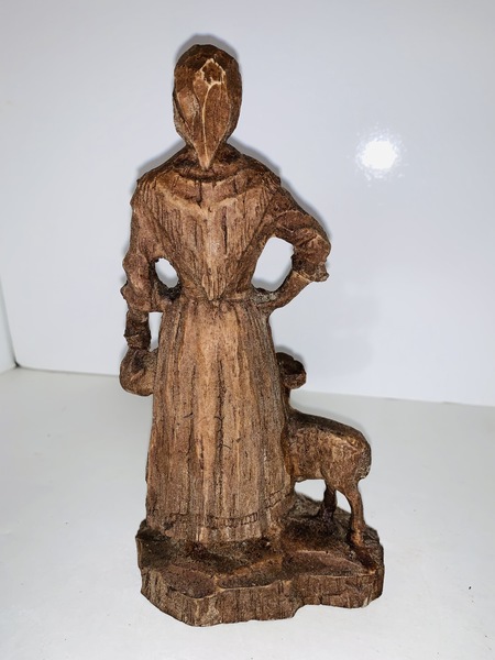 Folk Art carved Peasant Woman with a lamb.