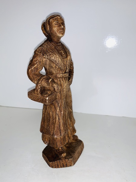 Carved Peasant Woman with a basket.