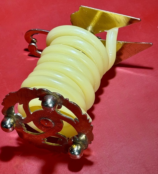 25-041. An Engraved Brass Wax Jack.