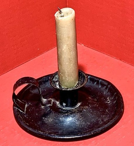 23-115. Early tin chamber stick