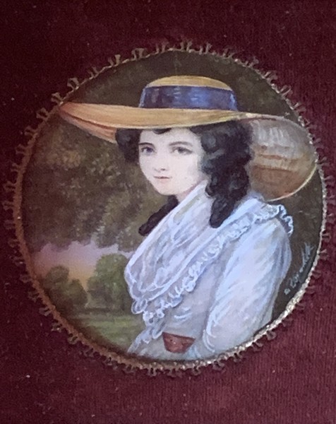 22-029. Portrait miniature of a young woman.