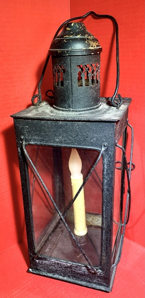 23-104. A candle lantern made of sheet iron