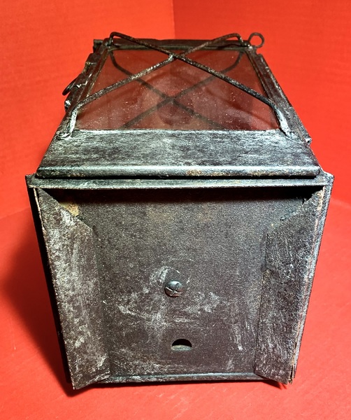 23-104. A candle lantern made of sheet iron
