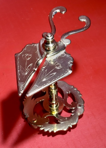 25-041. An Engraved Brass Wax Jack.