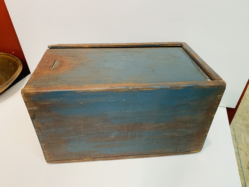 Slide lid storage box made of softwood.