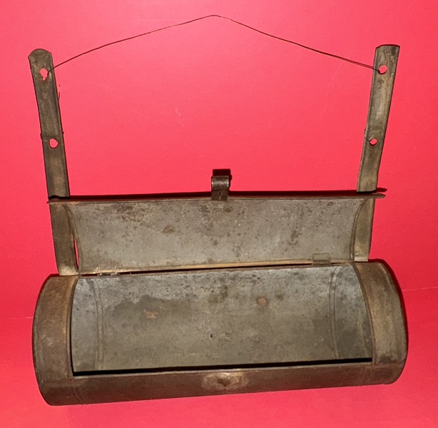 25-076. Cylindrical, pierced tin candle box