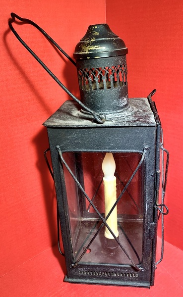 23-104. A candle lantern made of sheet iron