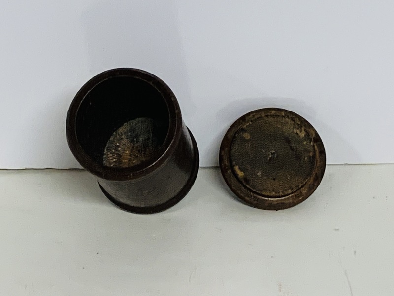 A Small round, turned wooden jar with lid