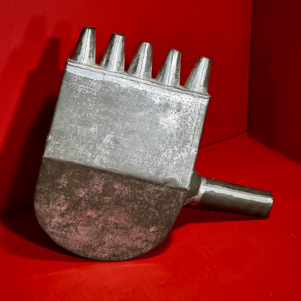 26-066. A Tin Candle Mold Wax-Filler