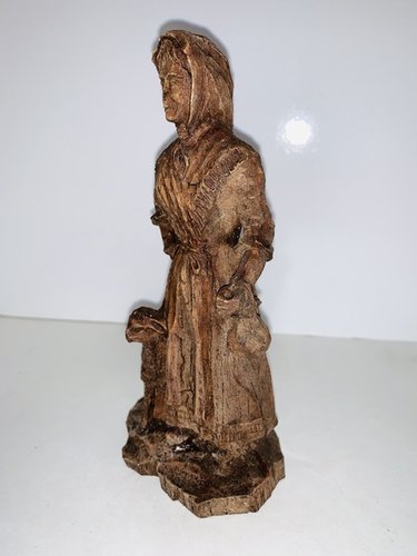Folk Art carved Peasant Woman with a lamb.