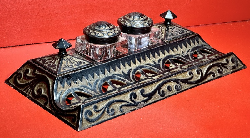 24-019. A two-well Cast-Iron ink well stand