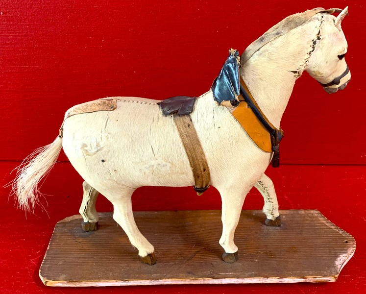 22-136. Horsehide covered carved horse