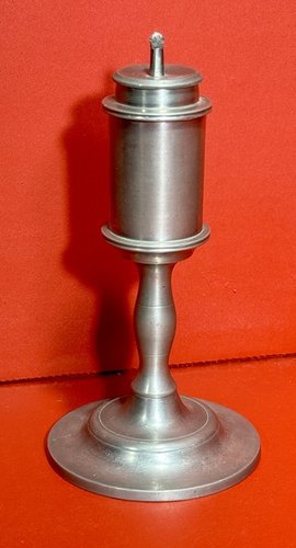 24-110. A small pewter whale oil lamp