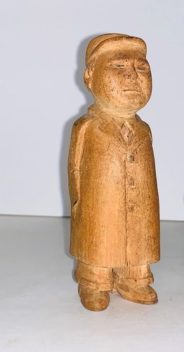 Carved figure of the Chinese leader Mao Zadung.