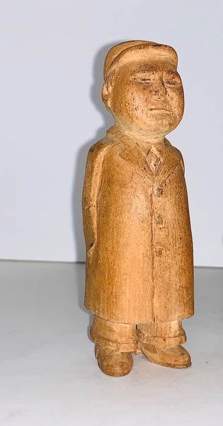Carved figure of the Chinese leader Mao Zadung.