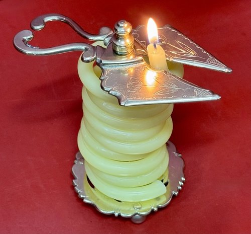 25-041. An Engraved Brass Wax Jack.