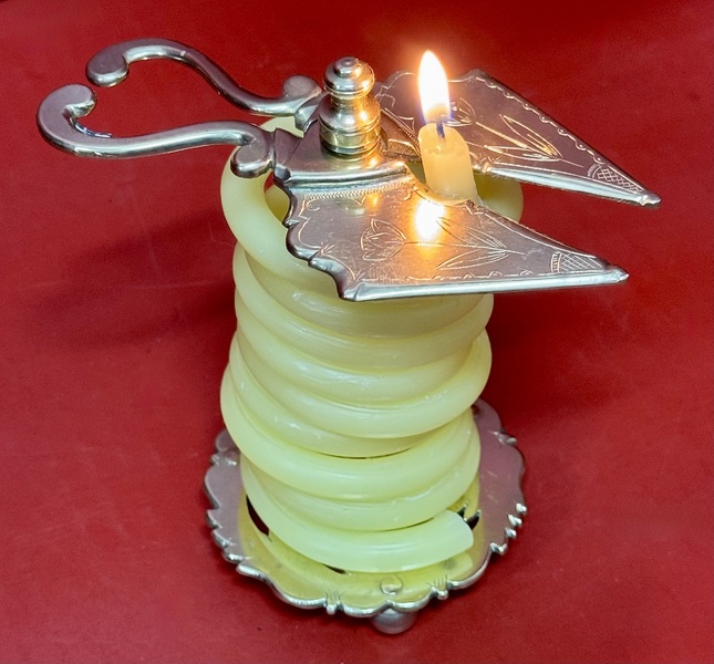 25-041. An Engraved Brass Wax Jack.