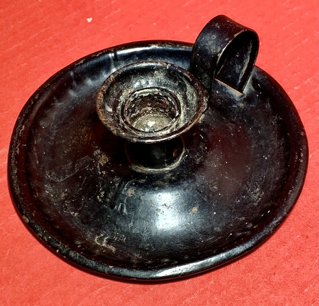 23-115. Early tin chamber stick