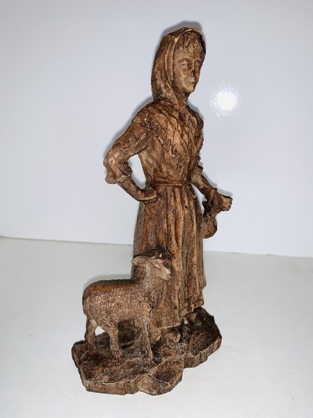 Folk Art carved Peasant Woman with a lamb.