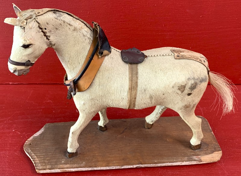 22-136. Horsehide covered carved horse