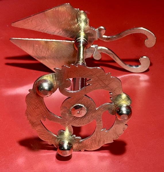 25-041. An Engraved Brass Wax Jack.