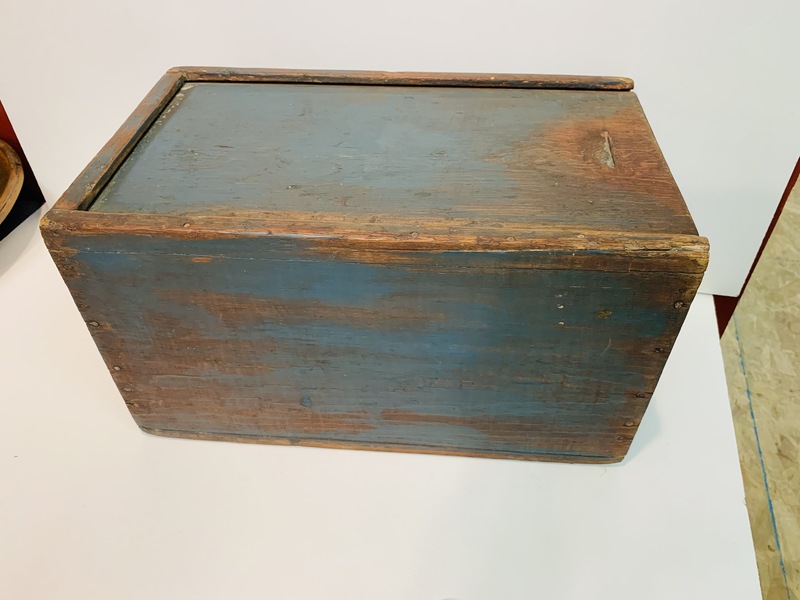 Slide lid storage box made of softwood.
