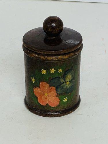 A Small round, turned wooden jar with lid
