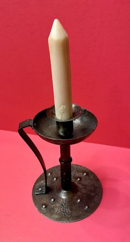 22-004. An Arts and Crafts sheet iron candlestick