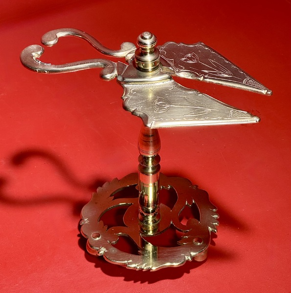 25-041. An Engraved Brass Wax Jack.