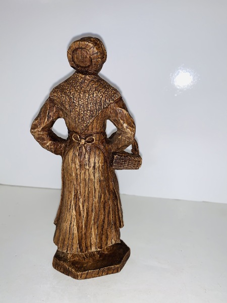 Carved Peasant Woman with a basket.